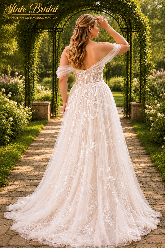 Vestido de novia corte A con encaje y espalda descubierta con mangas caídas de tul.